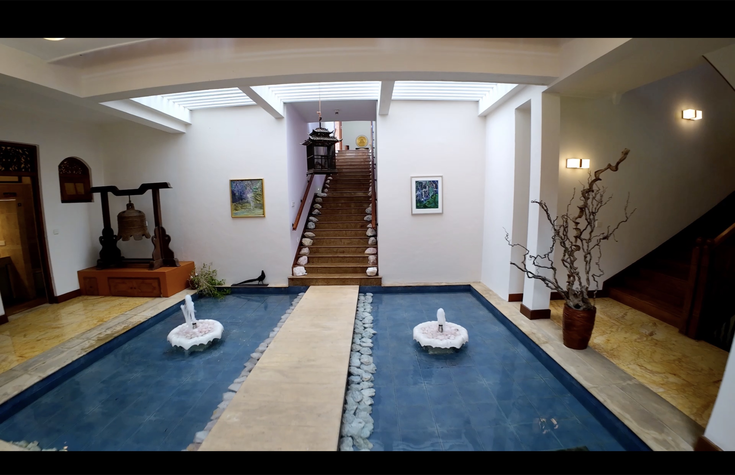Grand reception hall with marble floors and double-height volume at Oasis Estate