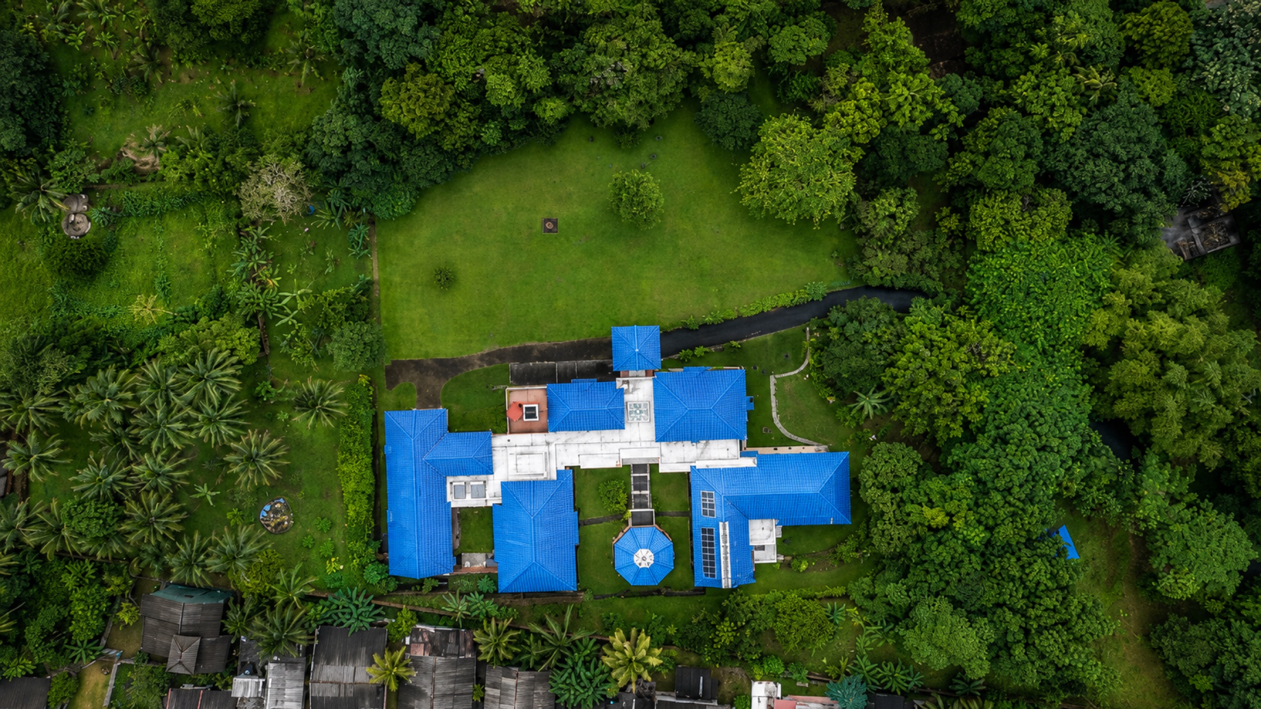 Top-down aerial view of Oasis Estate revealing scale and garden layout
